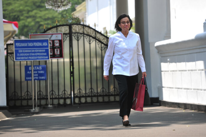 Sri Mulyani Indrawati tersenyum cerah usai menemui Presiden Jokowi, di Istana Kepresidenan, Jakarta, Selasa (22/10) pagi | Foto: Jay/Humas